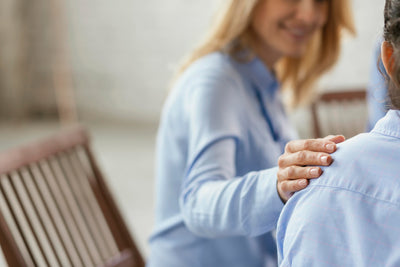 Two women sharing experiences in Long Covid support group
