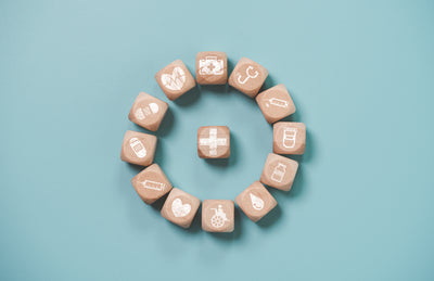 Wooden blocks with medical icons symbolizing managing Long Covid symptoms