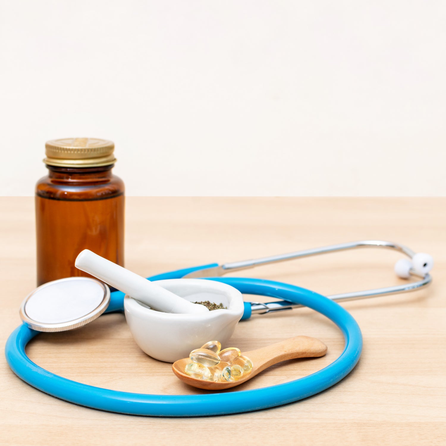 Supplements, stethoscope, and herbal remedies representing science-backed recovery products for Long Covid