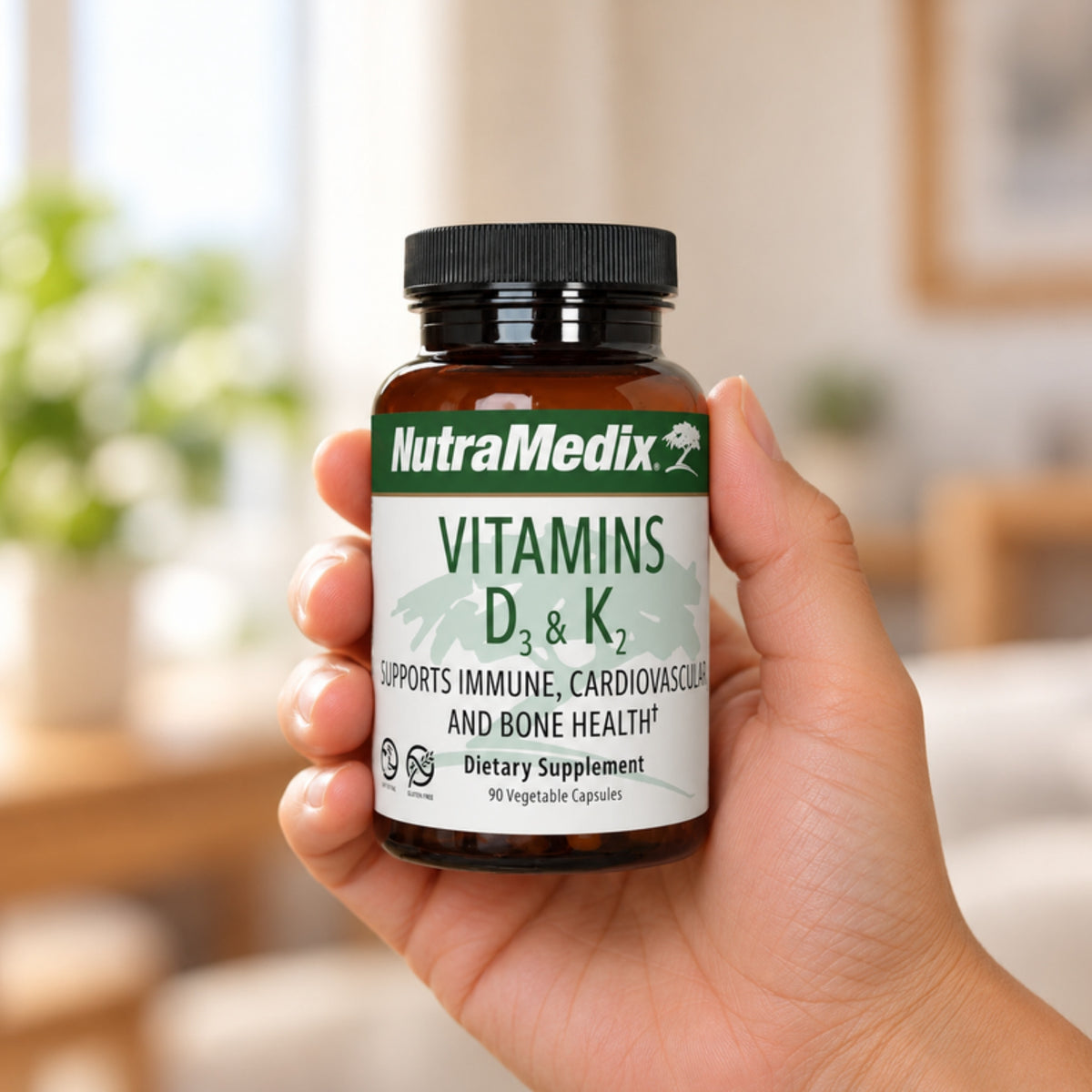 NutraMedix Vitamin D3 & K2 5000 IU held in an adult hand to show its size
